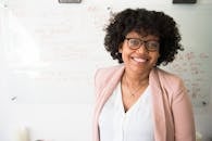 pexels-photo-1181519-1181519 Woman Standing Near Whiteboard